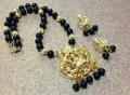 Microplated Gold Mahalakshmi Pendant & Earrings on Blacks Beads Microplated Gold Mahalakshmi Pendant & Earrings on Blacks Beads