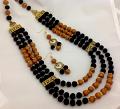Three layered Golden & Black Beaded Haaram Necklace Set Three layered Golden & Black Beaded Haaram Necklace Set
