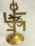 Auspicious Brass OM Symbol, Trishul & Swastika Statue Auspicious Brass OM Symbol, Trishul & Swastika Statue
