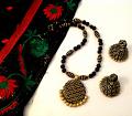 Black & Gold Embossed Pendant Set /w Jhumka Earrings Black & Gold Embossed Pendant Set /w Jhumka Earrings